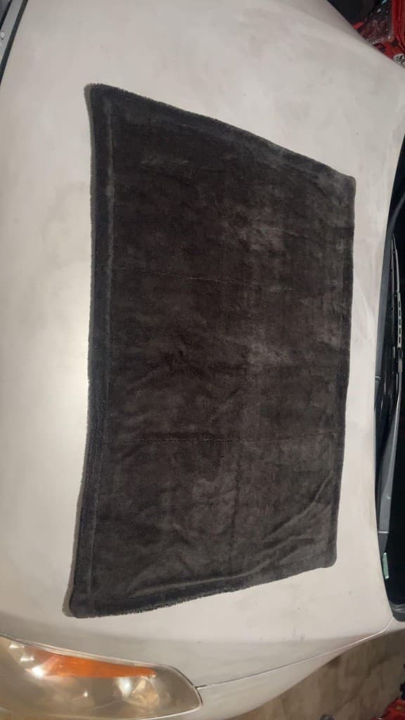 BlackFiber microfiber towel on a car hood after a wash